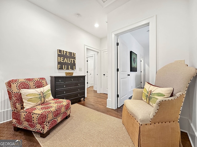 living area with hardwood / wood-style flooring