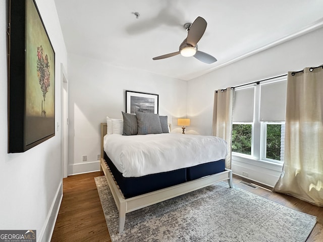 bedroom featuring ceiling fan and dark hardwood / wood-style flooring