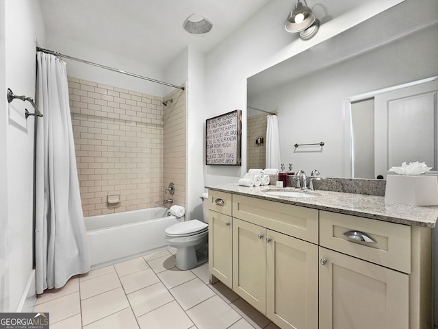 full bathroom featuring vanity, toilet, tile patterned floors, and shower / bath combo