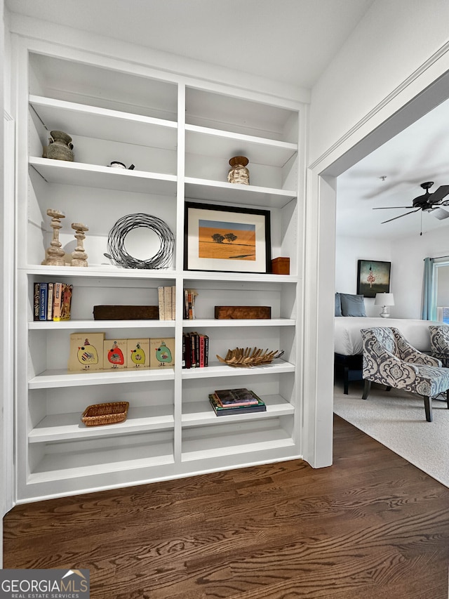 interior space with ceiling fan and hardwood / wood-style flooring