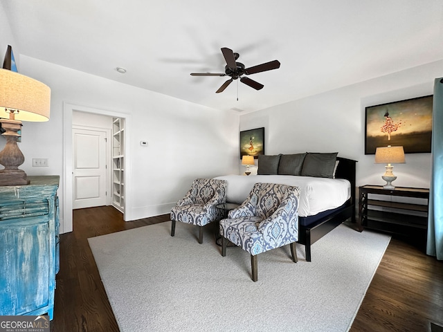 bedroom with dark wood-type flooring and ceiling fan