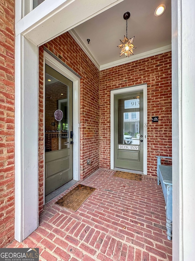 property entrance with ceiling fan