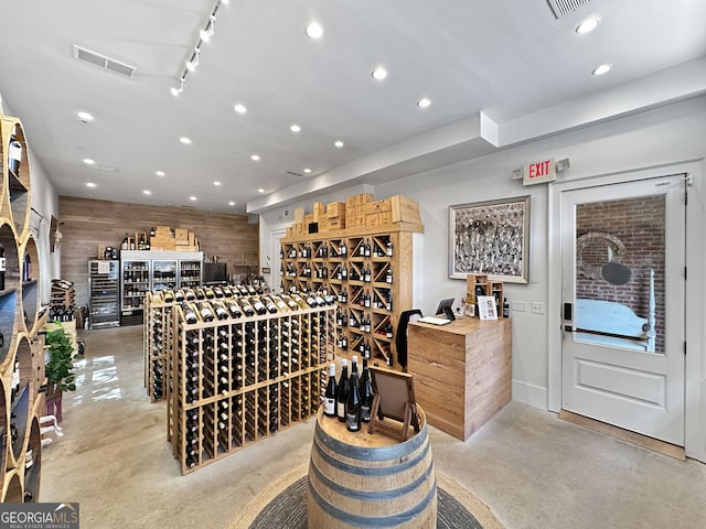 wine room featuring wooden walls