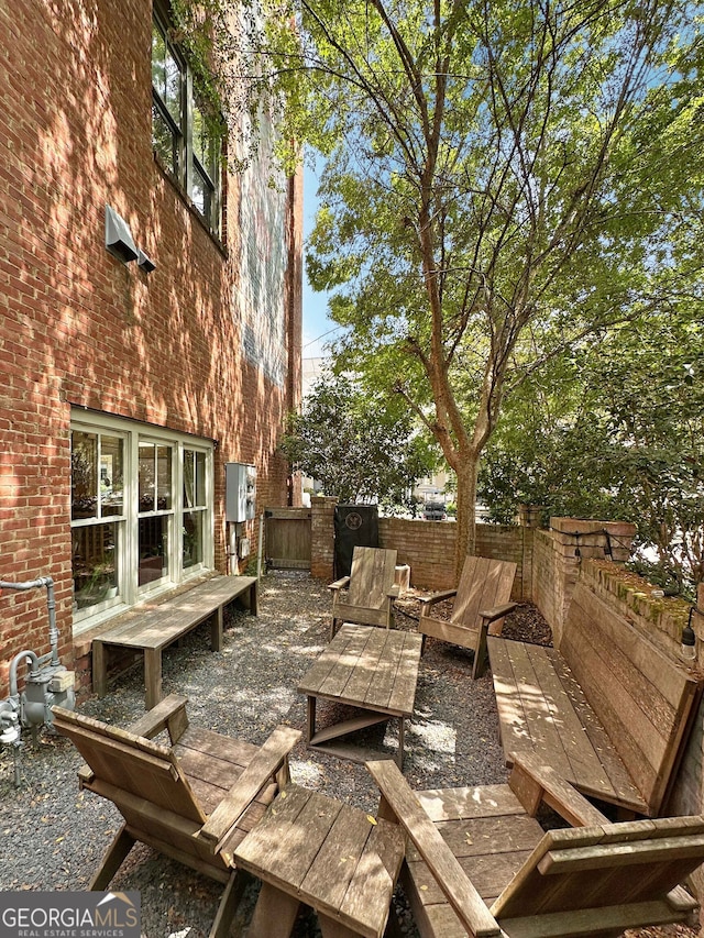 wooden terrace featuring a patio