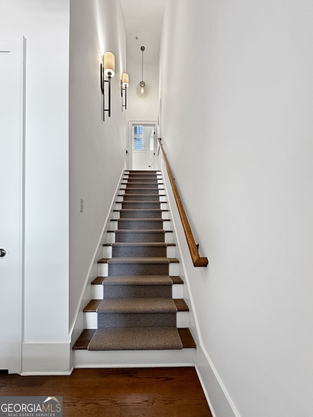 stairs with hardwood / wood-style flooring