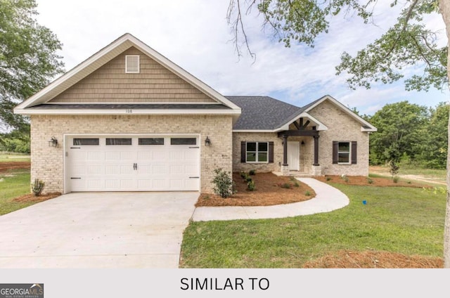 craftsman-style home featuring a front yard and a garage