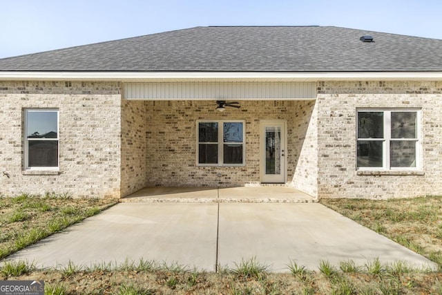 rear view of property with a patio and ceiling fan