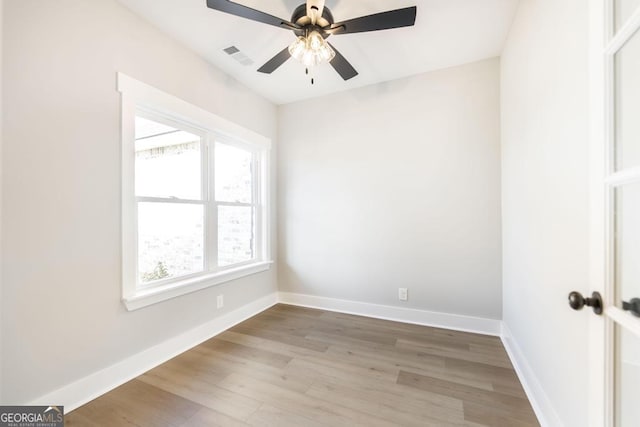 unfurnished room with wood-type flooring and ceiling fan