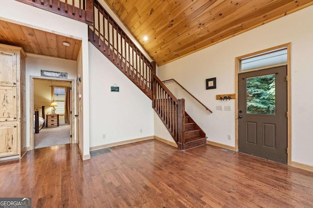 entryway with wood ceiling and hardwood / wood-style flooring