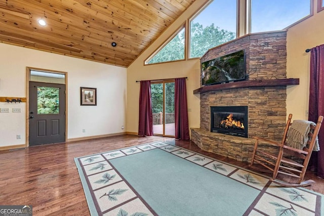 living room featuring a fireplace, high vaulted ceiling, wood ceiling, and wood-type flooring