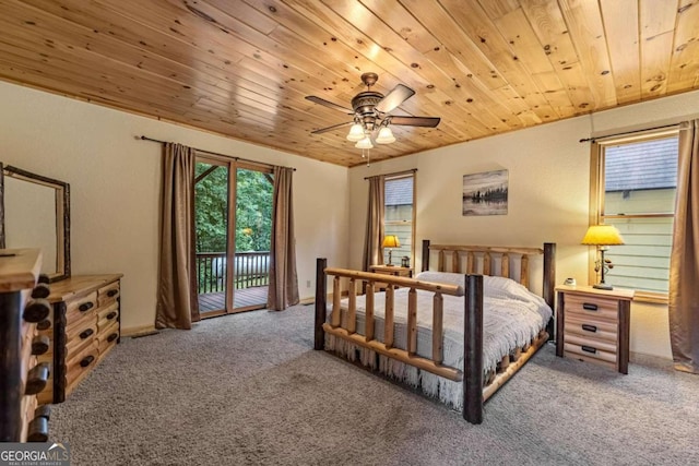 carpeted bedroom featuring access to exterior, ceiling fan, and wood ceiling