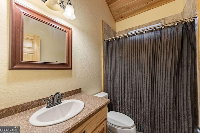 bathroom with wooden ceiling, walk in shower, lofted ceiling, toilet, and vanity