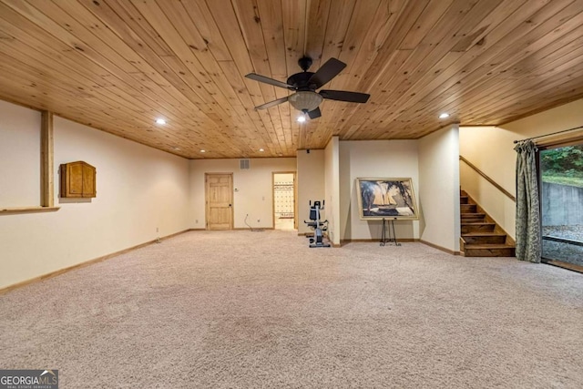 unfurnished living room featuring light carpet, ceiling fan, and wooden ceiling