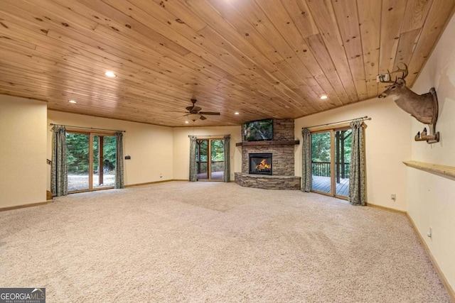 unfurnished living room with a healthy amount of sunlight and carpet flooring