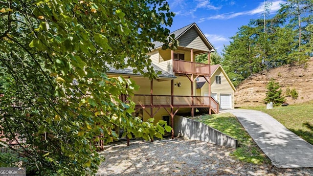 view of front of house with a garage and a balcony