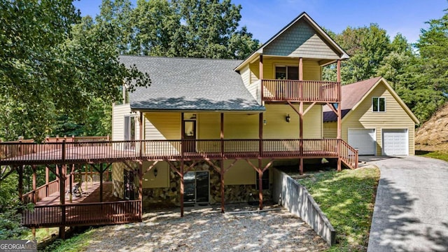 view of front of property with a garage and a deck