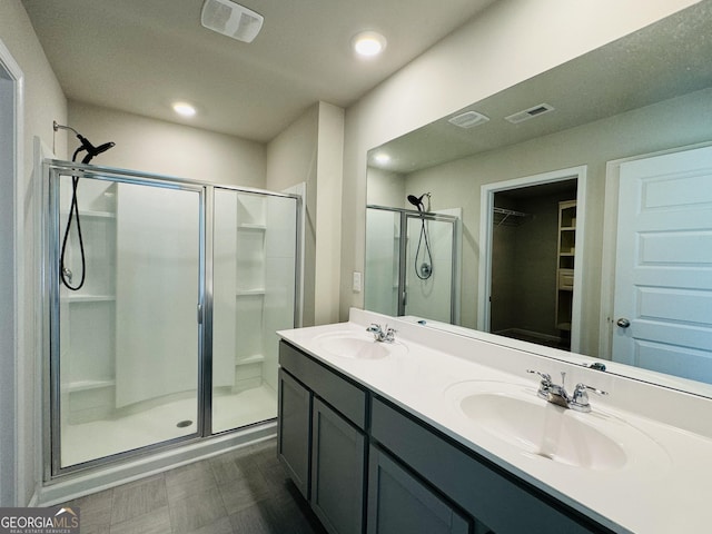 bathroom with vanity and an enclosed shower