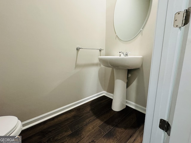 bathroom featuring toilet and hardwood / wood-style floors