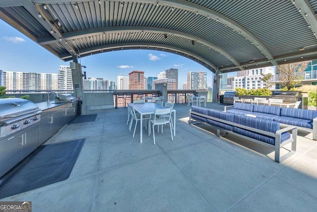 view of patio featuring grilling area, an outdoor hangout area, and area for grilling