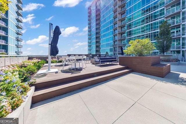 view of patio / terrace with a balcony and a wooden deck