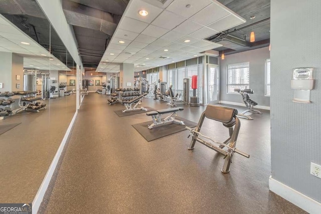 workout area featuring a drop ceiling