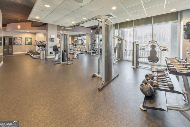 workout area with a drop ceiling