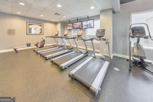 workout area featuring a paneled ceiling