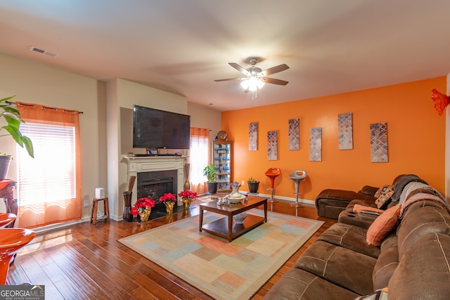 living room with ceiling fan and hardwood / wood-style flooring