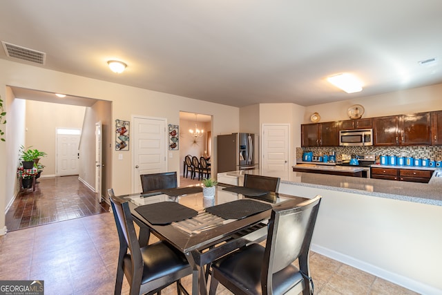 dining space featuring an inviting chandelier