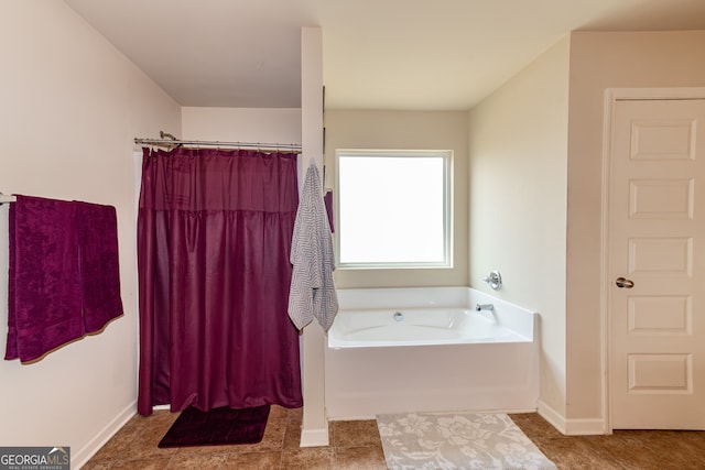 bathroom featuring separate shower and tub and tile patterned floors