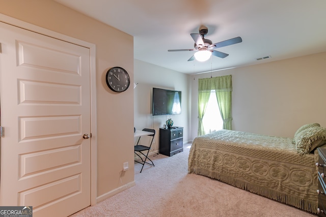 carpeted bedroom featuring ceiling fan