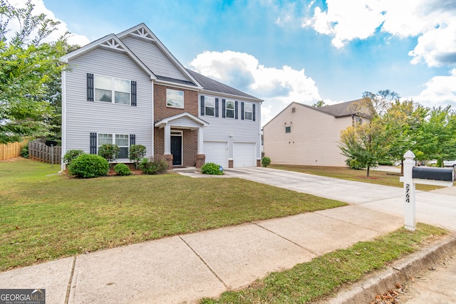 view of front of property with a front yard and a garage