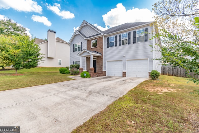 view of front of home with a garage and a front lawn