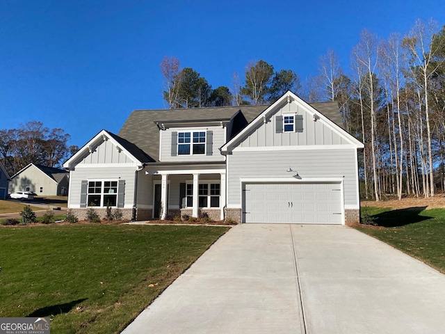140 Westminster Ct, Winder, GA 30680 - craftsman-style home featuring board and batten siding, brick siding, concrete driveway, an attached garage, and a front yard
