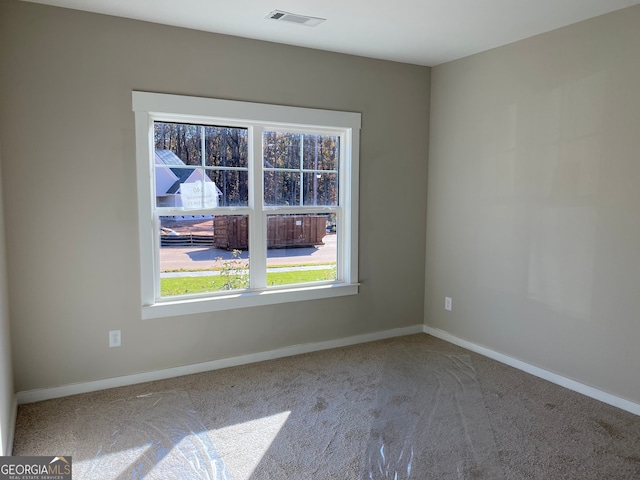 empty room with carpet flooring