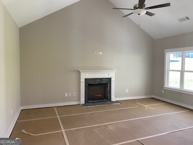 unfurnished living room with tile patterned floors, vaulted ceiling, and ceiling fan