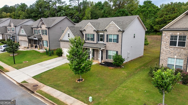 view of front facade with a front yard and a garage