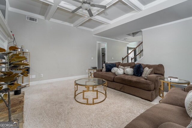 living room featuring light carpet, ceiling fan, coffered ceiling, and crown molding