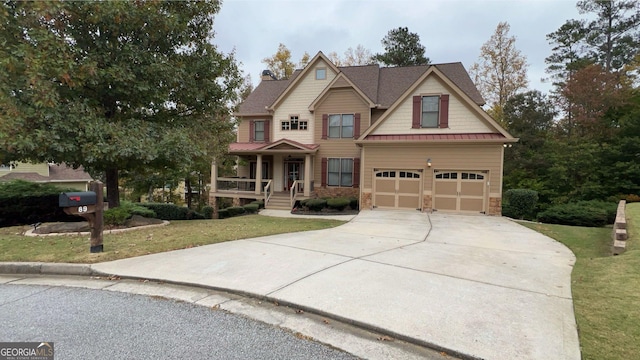 craftsman-style home with a porch, a garage, and a front lawn