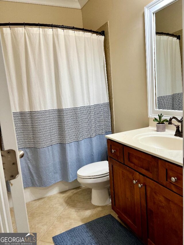 bathroom featuring toilet, vanity, and tile patterned floors