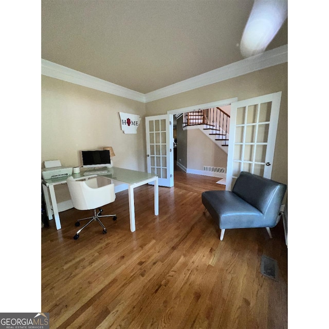 office space featuring french doors, hardwood / wood-style flooring, and ornamental molding