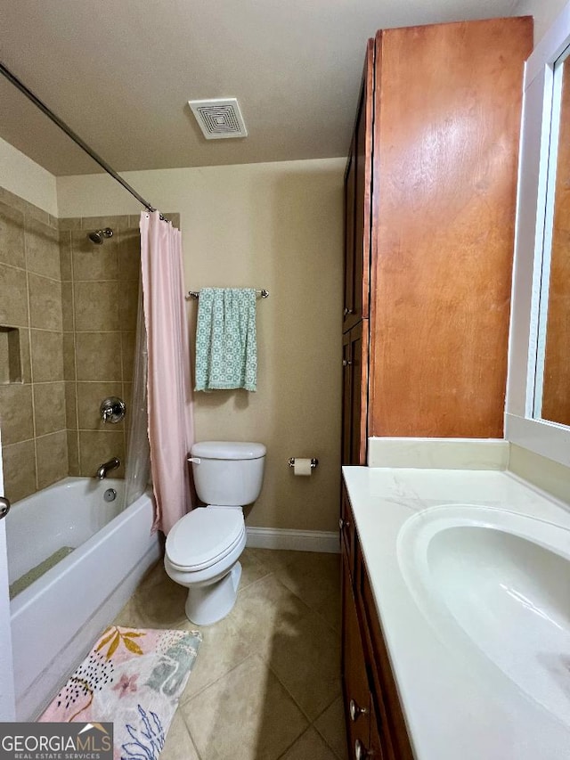 full bathroom with tile patterned floors, vanity, toilet, and shower / bathtub combination with curtain