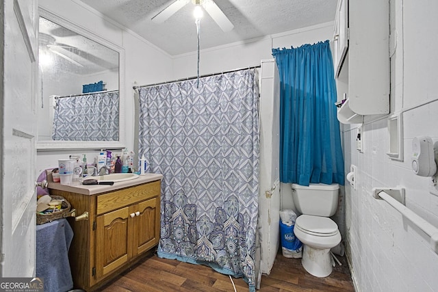 205 Georgia Ave, Barnesville, GA 30204 - full bath with toilet, ceiling fan, wood finished floors, a textured ceiling, and vanity