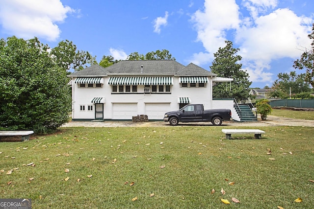 back of house with a yard