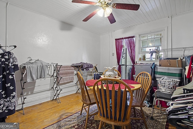 dining room featuring a ceiling fan and wood finished floors