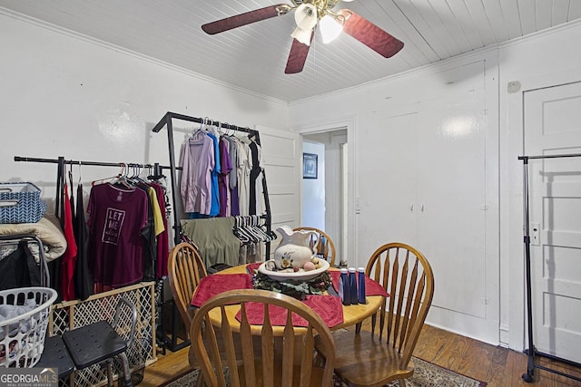 dining room featuring a ceiling fan, crown molding, and wood finished floors