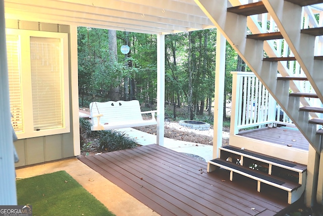 wooden deck with a patio