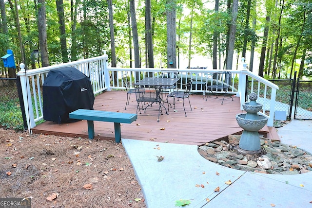 wooden deck featuring area for grilling