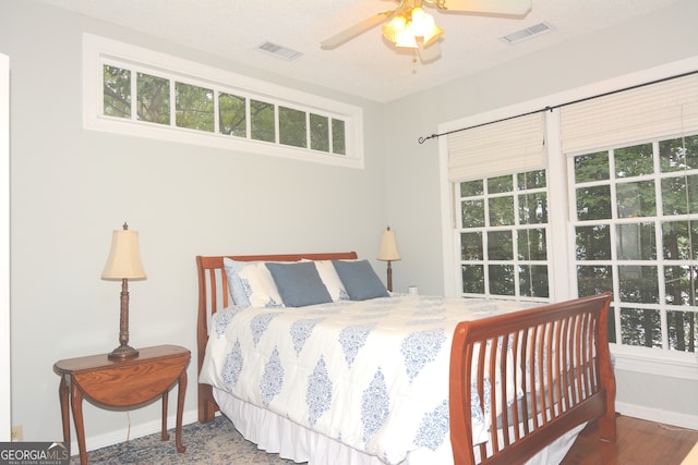 bedroom featuring ceiling fan and hardwood / wood-style flooring