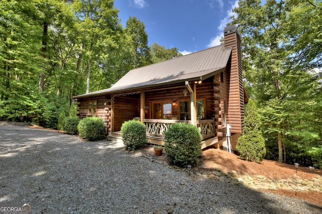 view of side of home featuring a porch